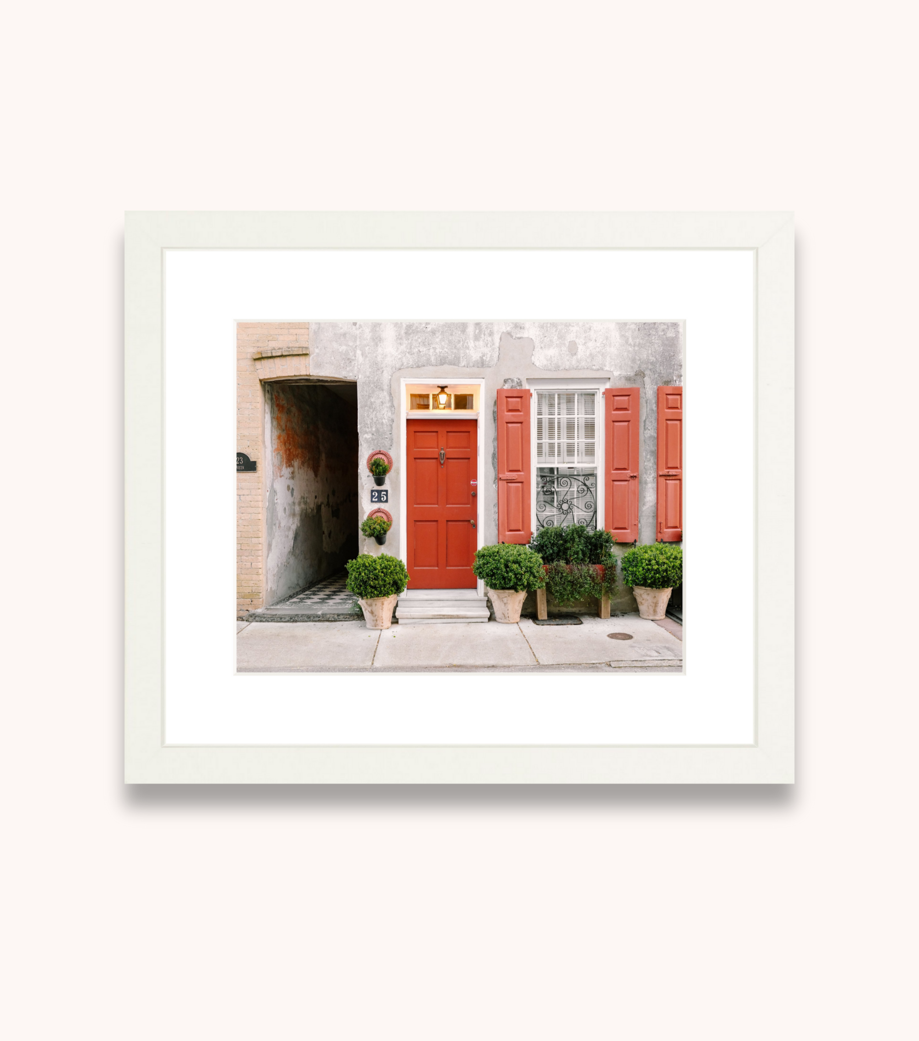 Framed Charleston wall art featuring a red door on historic Queen Street in downtown Charleston