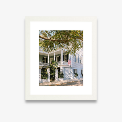 Charleston home with soft blue shutters and door – coastal photography print by Kelsey Bird