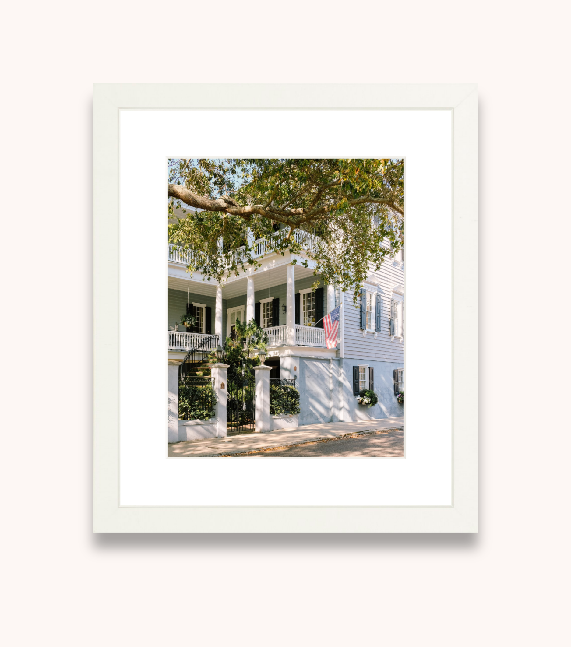 Framed Charleston wall art showcasing a blue historic Southern home