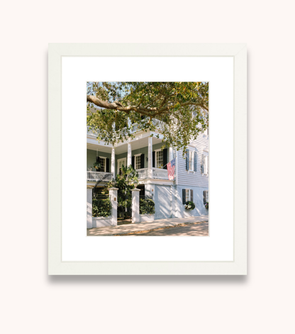 Framed Charleston wall art showcasing a blue historic Southern home