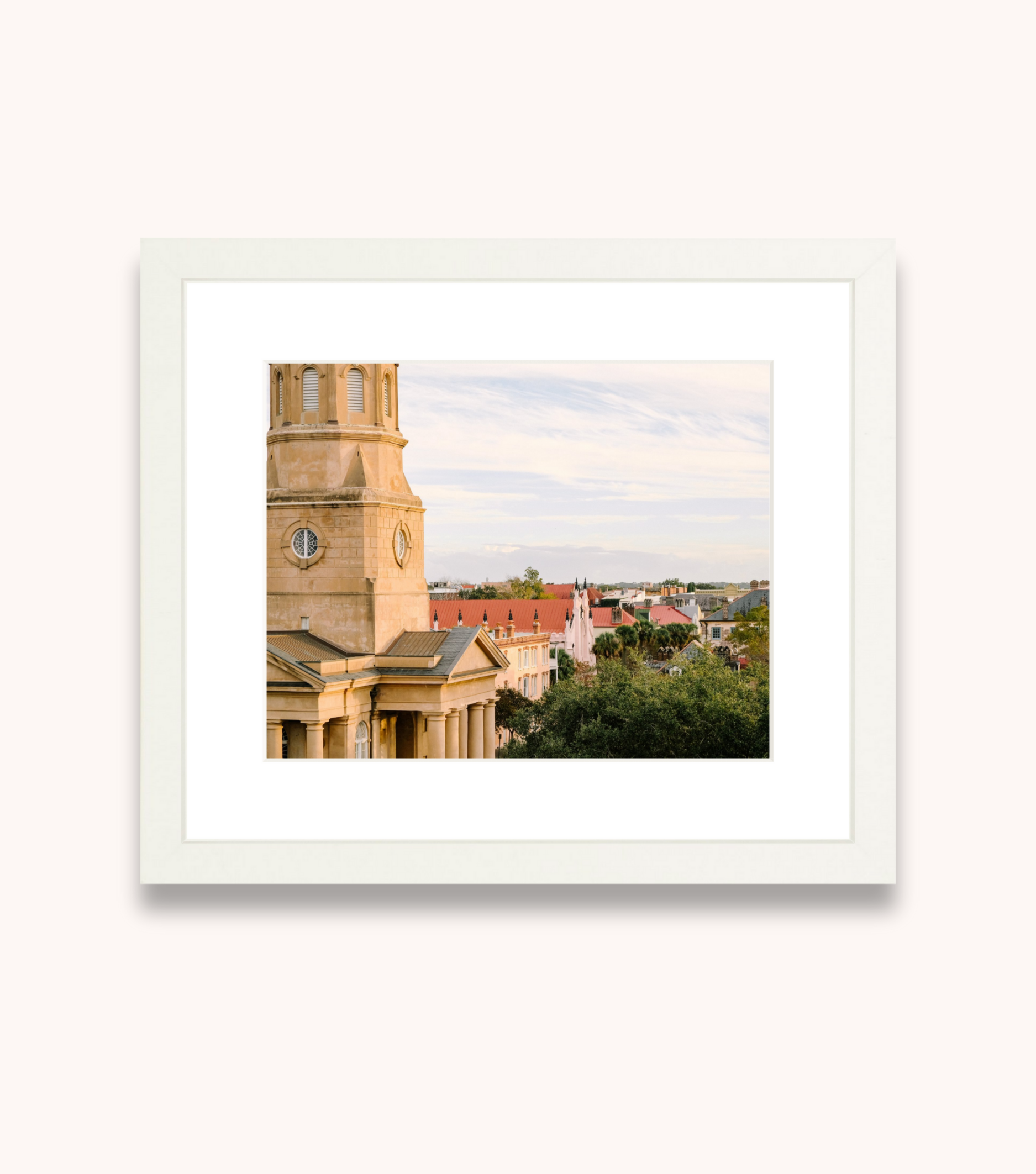 Framed Charleston wall art featuring the French Quarter skyline in soft evening light
