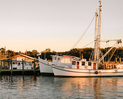 Shrimp boat docked at sunset along the Charleston waterfront reflecting Lowcountry coastal life