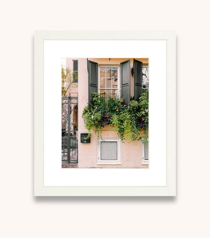 Framed Charleston wall art showcasing a flowering window box and Southern architecture