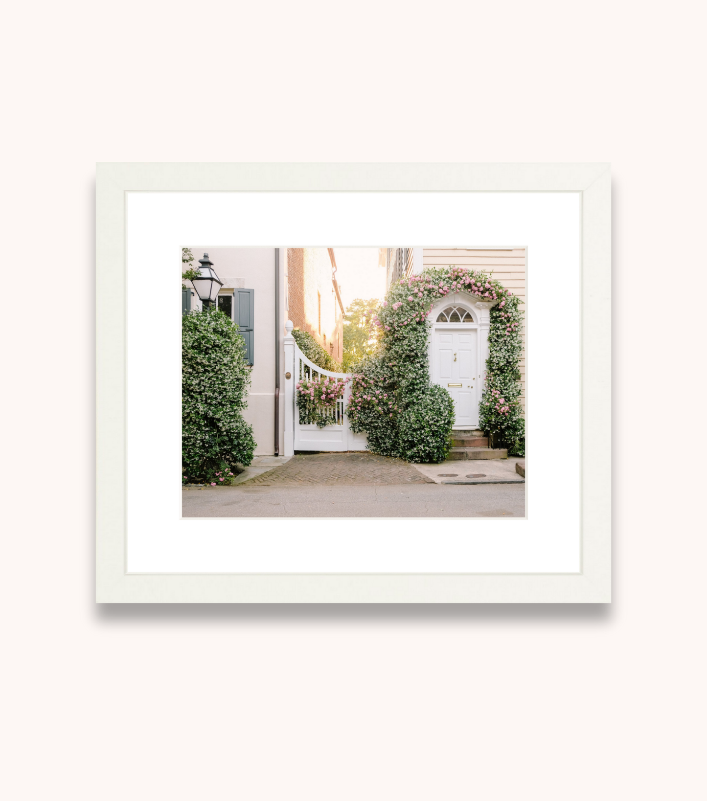 Framed Charleston wall art featuring jasmine flowers on Church Street architecture