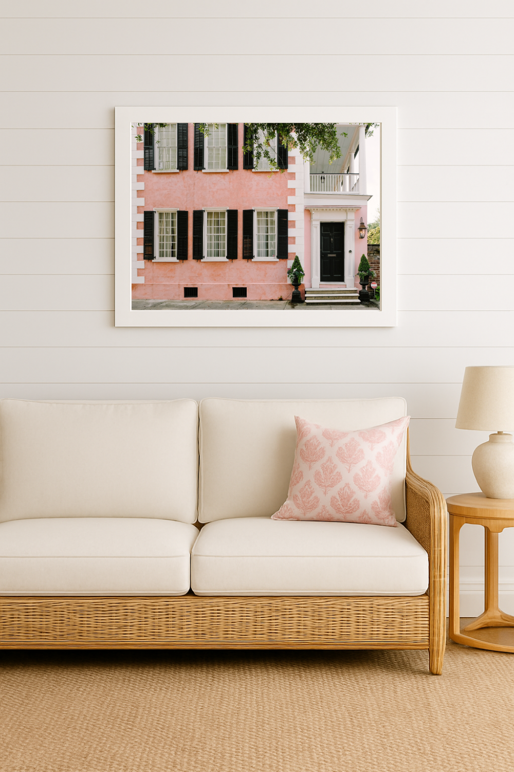 Charleston interior decor with framed pink house photography print in a coastal-inspired room