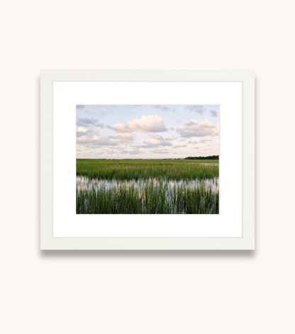 Framed Charleston wall art showcasing marsh grasses and tidal water at sunset
