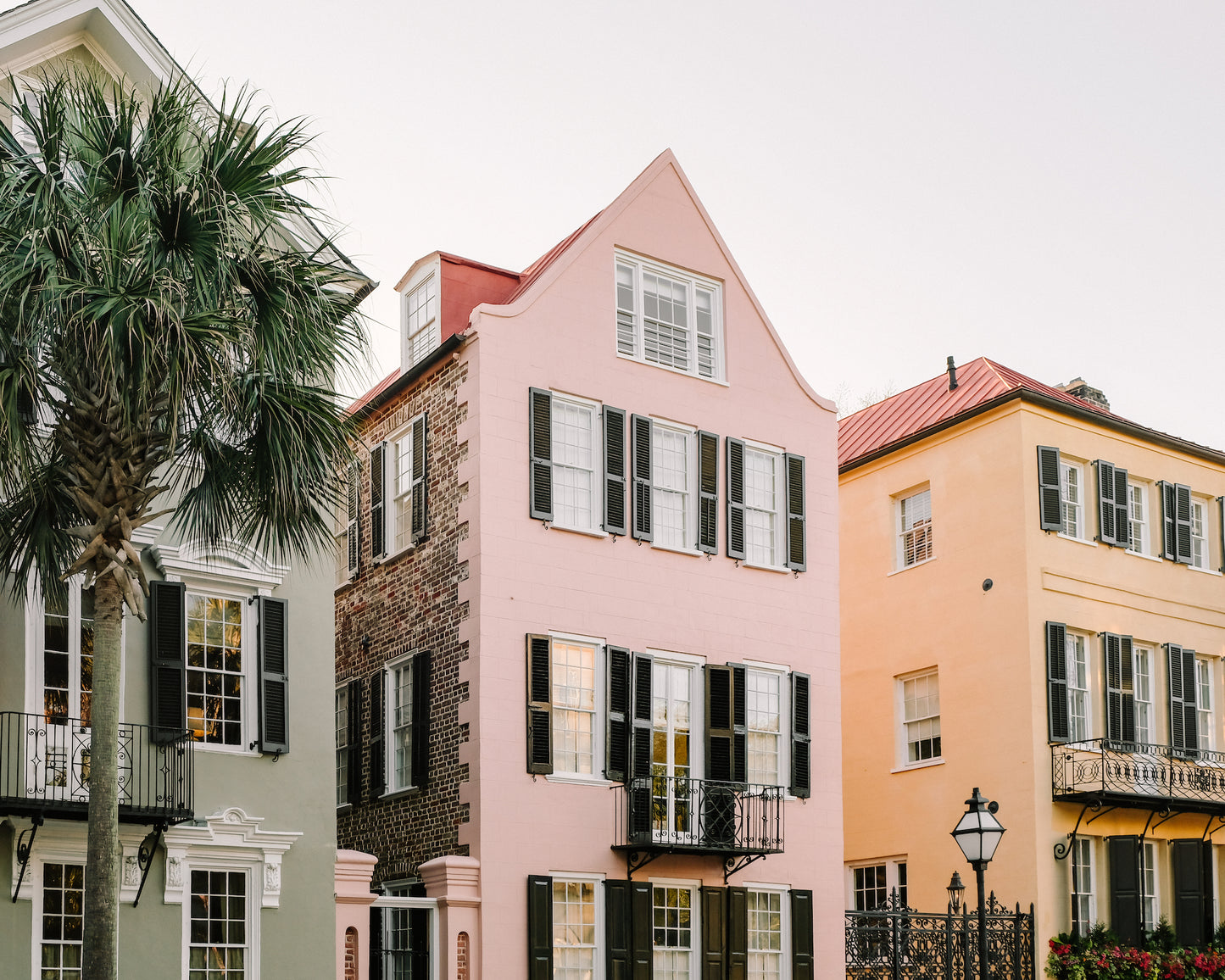Pastel Three Sisters homes in Charleston Historic District showcasing classic Southern architecture